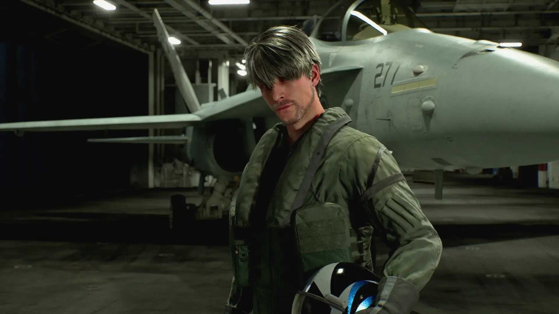 Ace Combat 8: Wings of Theve pilot character in flight suit standing beside fighter jet in hangar